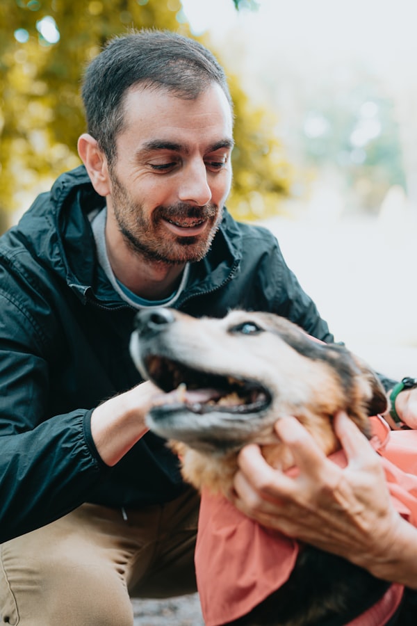 Man petting his dog